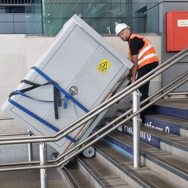 Safe cabinet being moved at cannon street train station